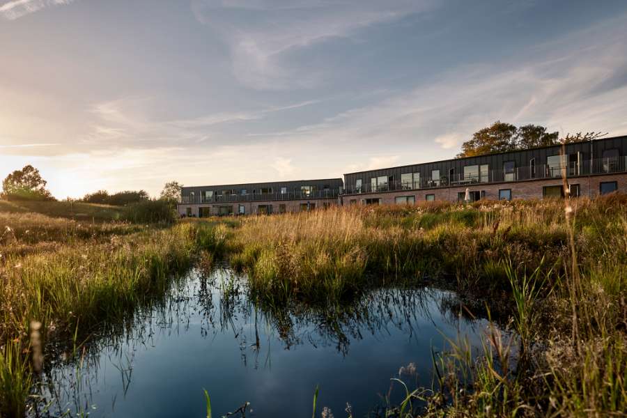 Historic forest gets a water lily neighbor clad with steel profiles, Åkandehaven, Langedam 1, 3250 Græsted, Denmark
